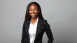 © Irina Ukrainets - Professional woman in a black blazer and white shirt smiling against a plain background. Formal attire example. Business headshot or corporate profile photo for professional use. AI