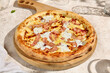 © Ryzhkov - Bacon Pizza with Cream Sauce in Sunlit Summer Shadows
