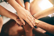 © Arnell K/peopleimages.com - Closeup, support and hands of business people in stack for collaboration and team building trust in creative agency. Community diversity, huddle and staff synergy for cooperation with partnership