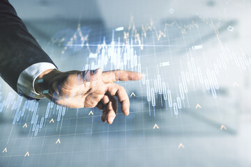 Poster - Multi exposure of man hand working with abstract financial diagram and world map on blurred office background, banking and accounting concept