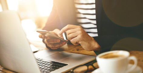 Aufkleber - Laptop, hands and man with phone in cafe for online email communication for business review. Freelancer, coffee and male hr with computer and cellphone for reading company policy with remote work.
