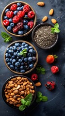 Wall Mural - A bowl of blueberries sits next to a bowl of almonds and a bowl of raspberries