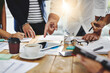 © Donson/peopleimages.com - Business people, hands and pointing with tablet in meeting for collaboration on project at office. Group of employees in conversation or discussion with paperwork or documents for brainstorming