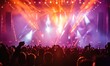 © piai - A music festival with an illuminated stage and a crowd of spectators