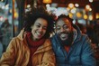 © Markus Schröder - Portrait of a cheerful multiethnic couple in their 40s wearing a functional windbreaker isolated on bustling restaurant background