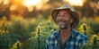 © Anastasiia - Joyful marijuana farmer protecting his valuable crop with care and pride. Concept Cannabis Cultivation, Joyful Farmer, Crop Protection, Pride in Work