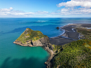 Wall Mural - scenic aerial view of the volcanic, rocky, black sand coastline of whatipu beach, north auckland. cl