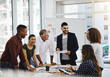 © Donson/peopleimages.com - Teamwork, creative group and business discussion in office, documents and collaboration together or brainstorming. Planning, company and goals or strategy with professionals in meeting with employees