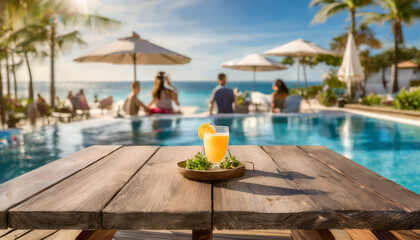 Wall Mural - Desk of free space and summer time on beach a wooden table, with the backdrop of a beach resort and guests having fun by the pool on a sunny day