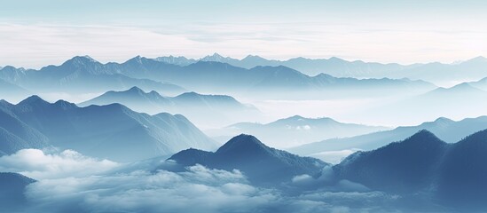 Aufkleber - Scenic view of misty mountain range with clouds in the foreground and a sea of mist between the peaks. with copy space image. Place for adding text or design