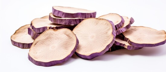 Poster - Close-up view of a bunch of purple potato slices, showcasing their vibrant color and texture. with copy space image. Place for adding text or design