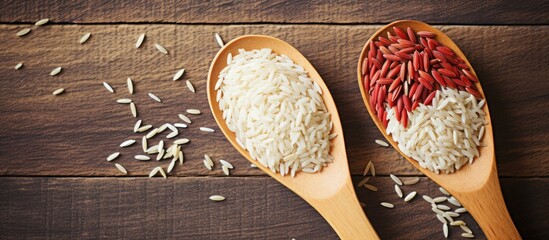 Aufkleber - Wooden spoons containing rice grains and a heap of uncooked rice beside them. with copy space image. Place for adding text or design