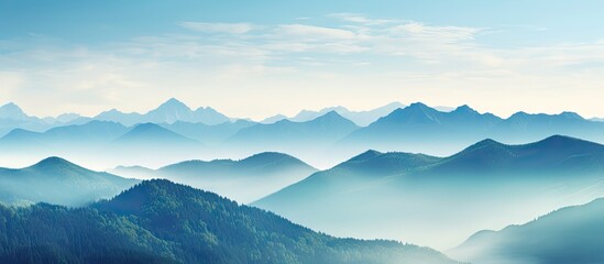 Poster - Sparse trees in the foreground of majestic mountains under a clear blue sky create a serene landscape. with copy space image. Place for adding text or design