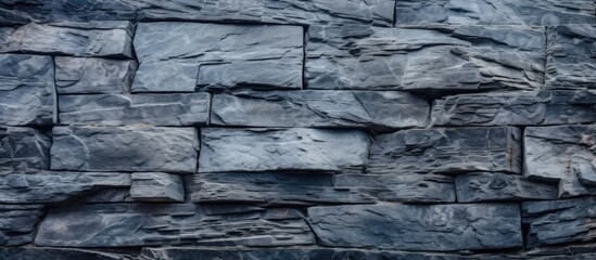 Fototapete - A bird is sitting on top of a textured stone wall, creating a natural and rustic background. with copy space image. Place for adding text or design