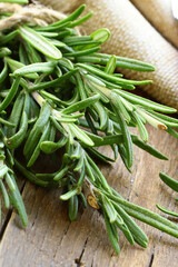 Poster - organic bunch of rosemary on wooden board