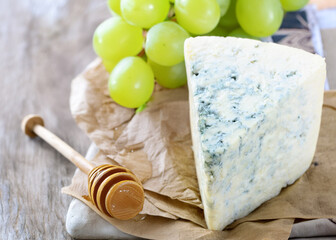 Poster - organic blue cheese gorgonzola roquefort on the table