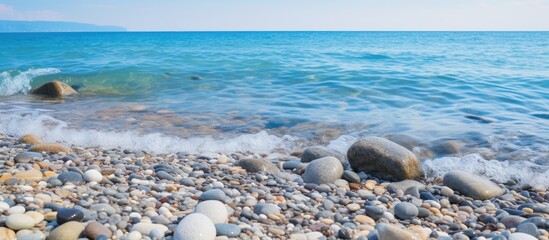Aufkleber - Scenic view of rocky seashore with small pebble beach, waves carrying foam. with copy space image. Place for adding text or design