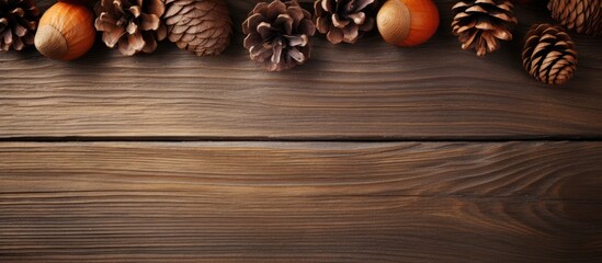 Aufkleber - Assorted pine cones and nuts scattered on a wooden table surface, creating a rustic aesthetic. with copy space image. Place for adding text or design