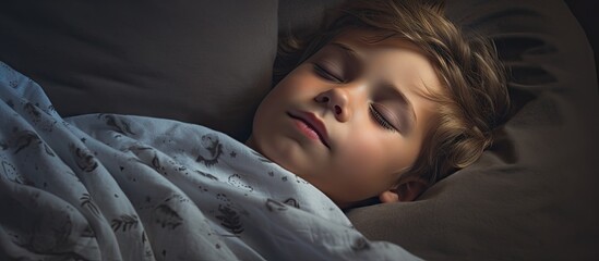 Aufkleber - Young child peacefully sleeping in a comfortable bed with a cozy blanket. with copy space image. Place for adding text or design