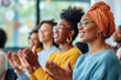 © vefimov - Group of women clapping and showing appreciation for one another