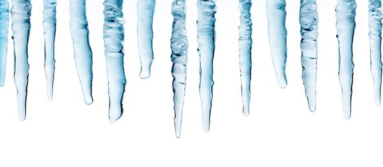 Aufkleber - Multiple icicles hanging in a row, viewed up close, against a blurred background. with copy space image. Place for adding text or design