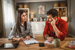 © Miljan Živković - woman financial adviser explain the insurance policy to the men client