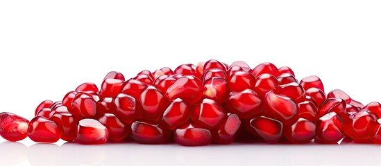 Leinwandbilder - Several fresh pomegranates stacked in a close-up view on a clean white surface. with copy space image. Place for adding text or design
