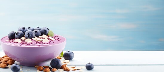 Aufkleber - Fresh fruit and nuts in a purple bowl, accompanied by vibrant blueberries, placed on a clean white table. with copy space image. Place for adding text or design