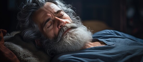 Poster - A close-up of a bearded man peacefully sleeping in bed with a serene expression. with copy space image. Place for adding text or design