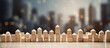 © vxnaghiyev - Arrangement of wooden blocks on a table with a city in the background, depicting a strategic planning concept to prevent a domino effect or collapse in business. with copy space image