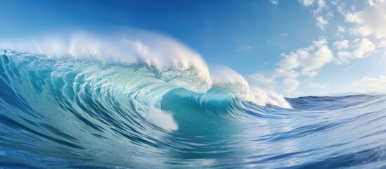 Poster - Close-up of a big wave in the ocean, with white foam cresting against the backdrop of a clear blue sky. with copy space image. Place for adding text or design