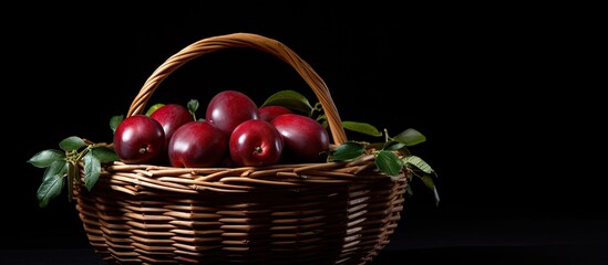 Wall Mural - Basket containing apples placed on a wooden table. with copy space image. Place for adding text or design