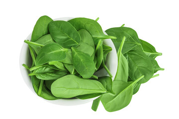 Wall Mural - Baby spinach leaves in ceramic bowl isolated on white background. Top view. Flat lay