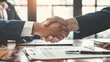 © Tanakorn - Business Partners Shake Hands After Successful Negotiation and Agreement, Close Up of Handshake, Deal Concept, Business Agreement