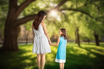 Wall Mural - Young Mother and daughter play in forest