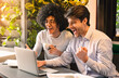 © Prostock-studio - Happy millennial men looking at laptop in cafe, enjoying great news about their project, empty space