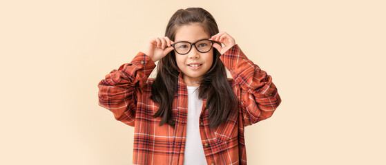 Canvas Print - Funny little girl with glasses on color background