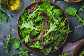 Wall Mural - salad leafy greens in bowl, top view