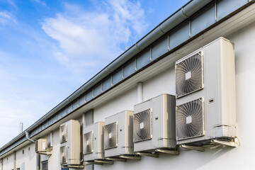 Wall Mural - Row of Dual Inverters, combination of heating and cooling pump, installed on industrial building