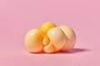 © Yaroslav Danylchenko/Stocksy - Handmade bubble shaped figure with orange cells on pink background