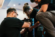 © Ezequiel Giménez/Stocksy - Technicians working together on LED panel on stage