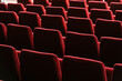 © Ezequiel Giménez/Stocksy - Rows of red seats in cinema theater