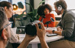 © VICTOR TORRES/Stocksy - Photography session in a modern podcast studio