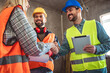 © Mediteraneo - Contractor.Construction worker team hands shaking after plan project contract  at construction site, contractor, engineering, partnership, construction concept