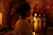 © AD Astra Team/Stocksy - Woman inside Buddhist Temple