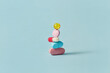 © Yaroslav Danylchenko/Stocksy - Pills stacked on top of each other intended for sickness recovery