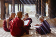 © Heng Yu/Stocksy - Monks studying under wooden structure