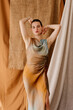 © Tania Cervian/Stocksy - Attractive model standing with hands behind head