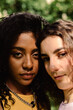 © Adrian Rodd/Stocksy - A close-up portrait looking at camera of two young women