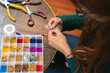 © A2 Images/Stocksy - Woman making costume jewelry accessories